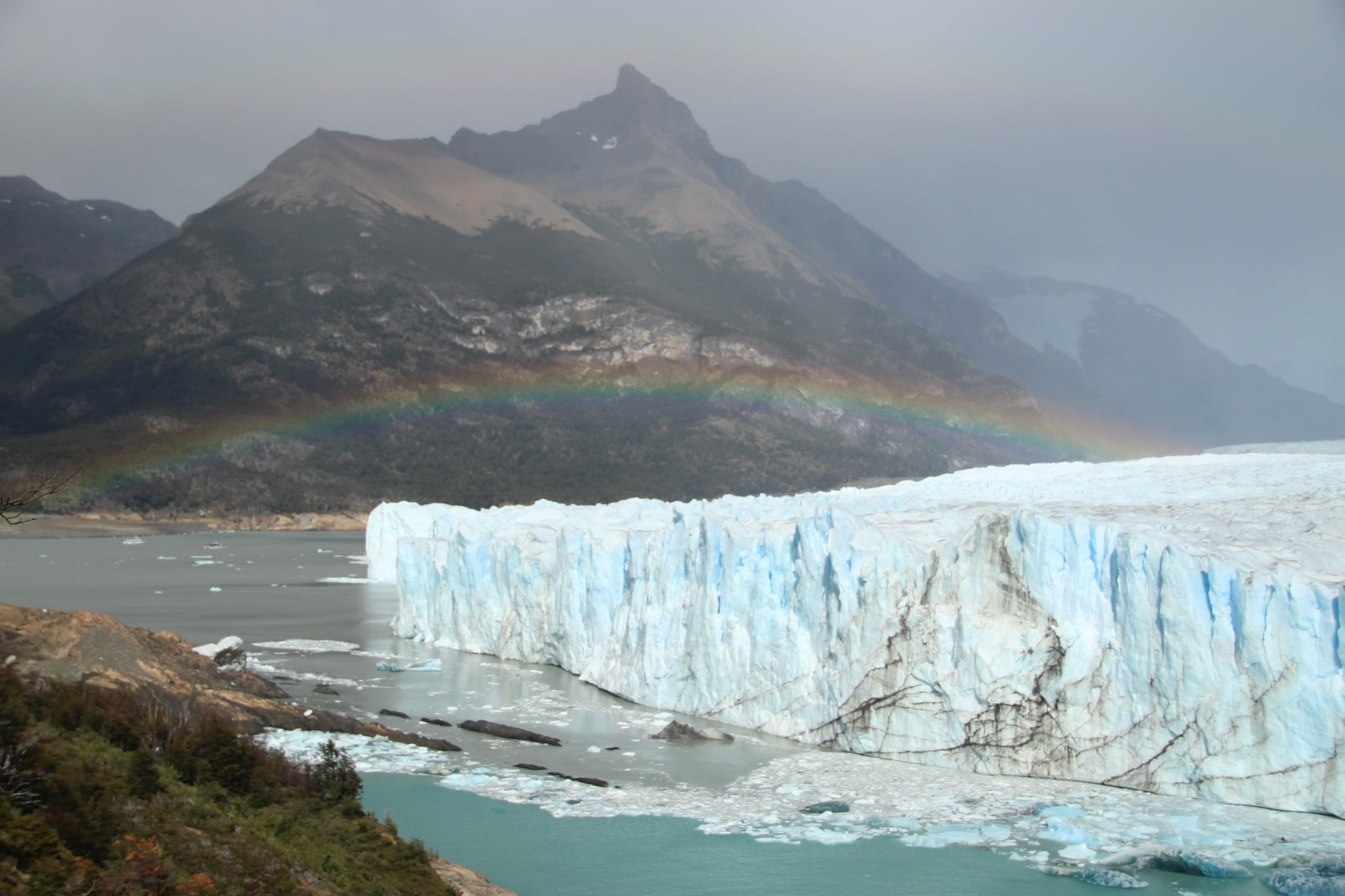 Perito Moreno glacier with rainbow