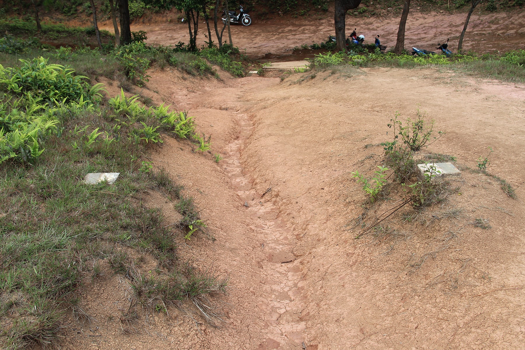 MAG signs on Phonsavan Jar Site path, Laos