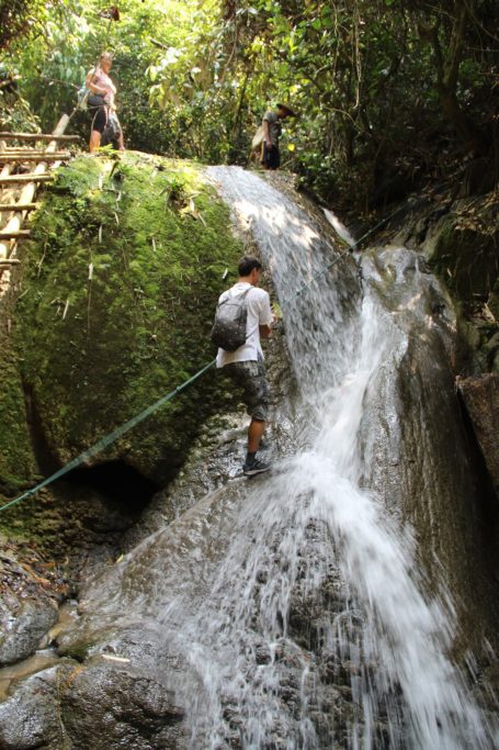 Florian climbing a waterfall in Nong Khiaw, Laos